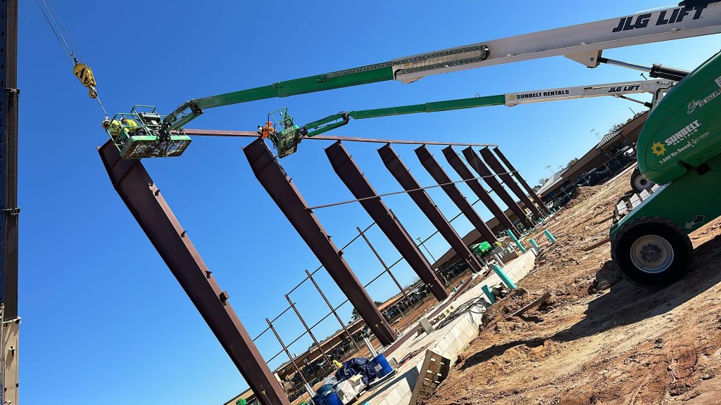 GS Steel Group dual boom lift crane rigging massive steel frame